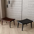Two Modern Wooden Stools With Dark Brown And Black Design On Light Wooden Floor