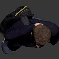 Man In Dark Blue Sweater Jeans With Yellow Backpack Touching Head Against Gray Background