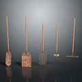 Rusty Long Handled Garden Tools Including Shovels Forks And Rakes Arranged On Dark Background