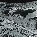Lunar Landscape With Rugged Terrain Large Impact Craters And Gray Surface