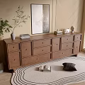 Light brown wooden entryway console cabinet with drawers wall art and plant decor