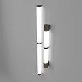 Two Wall Lamps With Long And Short White Light Tubes Black Bases Against Grey Background