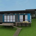 Container Guest House With Blue Exterior Large Glass Windows Wooden Deck And Lawn Area