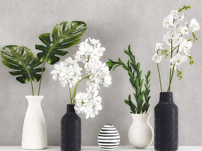 White Orchids And Tropical Leaves In Black White Striped Vases On Table 3d model