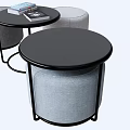 Public Office Area With Round Black Tables Gray Padded Stools And Books On Top