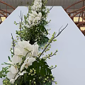 Elegant Floral Installation With Red Roses White Flowers Green Plants And Wooden Screen