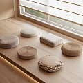 Various Round Square Floor Cushions On Wooden Window Platform With Woven Fabric