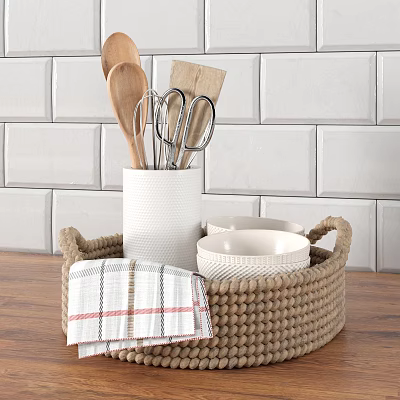 Kitchen Utensils In Woven Basket With Wooden Spoons Scissors And Plaid Cloth On Wooden Tabletop 3d model