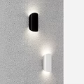Unique Shaped Wall Sconces Black and White Illuminated Mounted on Gray Wall