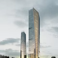 Two Modern Tall Office Buildings With Glass Facade Illuminated Under Overcast Sky