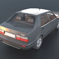Gray Classic Sedan Parked On Smooth Surface With Trees In Background