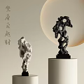 Two Decorative Stone Carvings White And Black Sculptures On Pedestals With Circular Background
