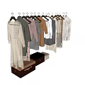 Neatly Arranged Various Styles Of Clothes Hanging On Hangers With Storage Boxes