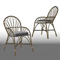 Rattan Leisure Chairs With Curved Frame And Light Gray Cushions For Outdoor Use