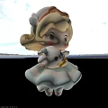 Cartoon Girl With Blonde Curly Hair Cat Ear Hat Holding Small Doll And White Animal