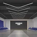 School Auditorium With Star Road Backdrop Blue Chairs And Ceiling Lights