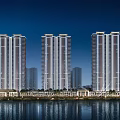 High rise residential buildings at night with exterior lighting and water reflection