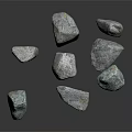 Several Natural Gray Stones With Rough Surface Texture On Dark Background