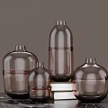 Brown Glass Vases In Different Sizes Placed On Marble Tabletop For Home Decor