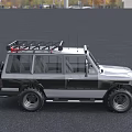 Silver And Black Off Road Car With Roof Rack Large Bumper And Off Road Tires