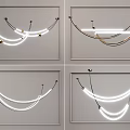 Modern Curved Line Chandelier With LED Strips And Sleek Metallic Design