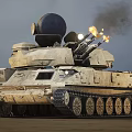 Military Tank With Radar System Firing Cannons Ejecting Flames On Desert Terrain