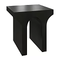 Black Modern Side Table With Arched Legs And Sleek Minimalist Design
