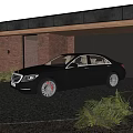 Black Luxury Sedan with Red Brake Calipers Parked at Brick Wall Garage on Gravel Driveway