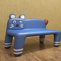 Cat Shaped Blue Public Bench With Ears Eyes Whiskers Red Tail And White Striped Legs