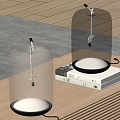 Modern Glass Bell Shaped Table Lamps With Transparent Shade And Warm Light On Books