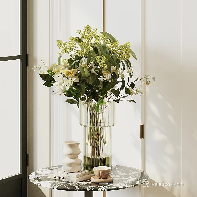 Glass Vase With Green Leaves And White Flowers On Table With Decorative Items 3d model 