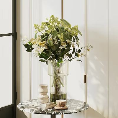 Glass Vase With Green Leaves And White Flowers On Table With Decorative Items 3d model