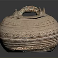 Carved Sculptural Pottery Jar With Lid Handles And Intricate Circular Patterns