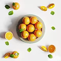 Fresh Oranges Arranged in Glass Container With Slices and Leaves