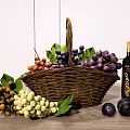 Fresh Assorted Fruits With Purple Green Red Grapes And Plums In Woven Basket On Table