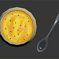 Creamy Yellow Pudding Dessert Topped with Black Seeds in White Bowl and Spoon