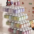 Colorful Decorative Ornaments Set with Bottles on Acrylic Storage Rack Multiple Layers Organized