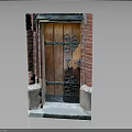 Traditional Wooden Door In Red Brick Wall With Ornate Metal Decorations And Stone Step