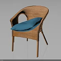 Wicker Outdoor Chair With Blue Cushion And Curved Armrests For Stylish Seating