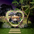 Romantic Outdoor Heart Shaped Flower Arch With String Lights And Sunset View