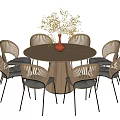 Round Wooden Dining Table Set With Rattan Back Chairs Black Cushions Red Vase Pink Flowers