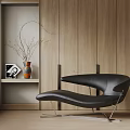 Modern Black Leather Chaise Lounge With Metal Frame By Wooden Wall And Shelf