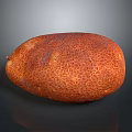 Fresh Orange Kiwano Melon With Honeycomb Textured Skin On Dark Background