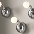 Modern Silver Wall Lamps With Round Globe Shades Mounted On Gray Wall