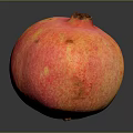 Fresh Red Orange Pomegranate With Speckled Skin On Dark Background