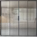 Modern Glass Sliding Door With Black Frame In Interior Design Featuring Textured Wall And Plant