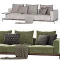 Beige and Green Three Seater Sofa with Decorative Pillows and Throw Blanket