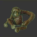 Realistic Red Orangutan Statue Sitting With Detailed Textured Surface On Gray Background