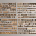 Various Styles of Wooden Fence Samples with Different Designs Neatly Arranged Together