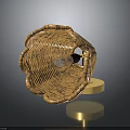 Brown Woven Basket Shaped Lamp With Gold Base And Light Bulb